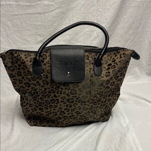 Chico’s leopard print tote bag with black handles.